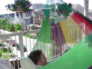 Paul in hammock on our balcony